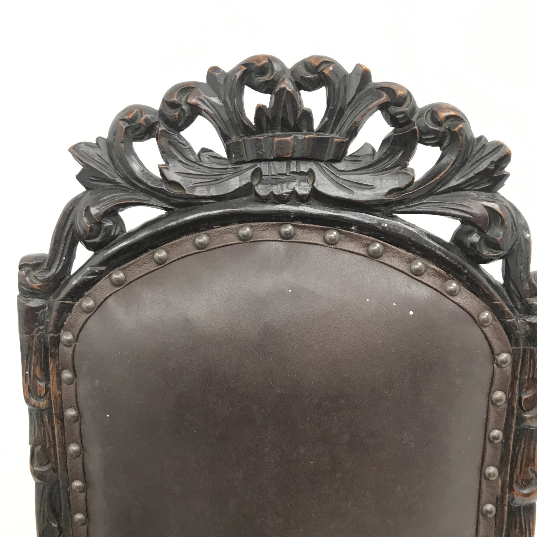 Jacobean style oak library chair, floral carved and pierced cresting rail, upholstered back seat and arms, barley twist supports (W68cm) and a similar oak hall chair, carved cresting rail and supports, upholstered back and seat (W52cm)