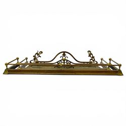Three 20th century brass fenders, two with pierced Art & Crafts design rails, largest W156cm, D 45cm 