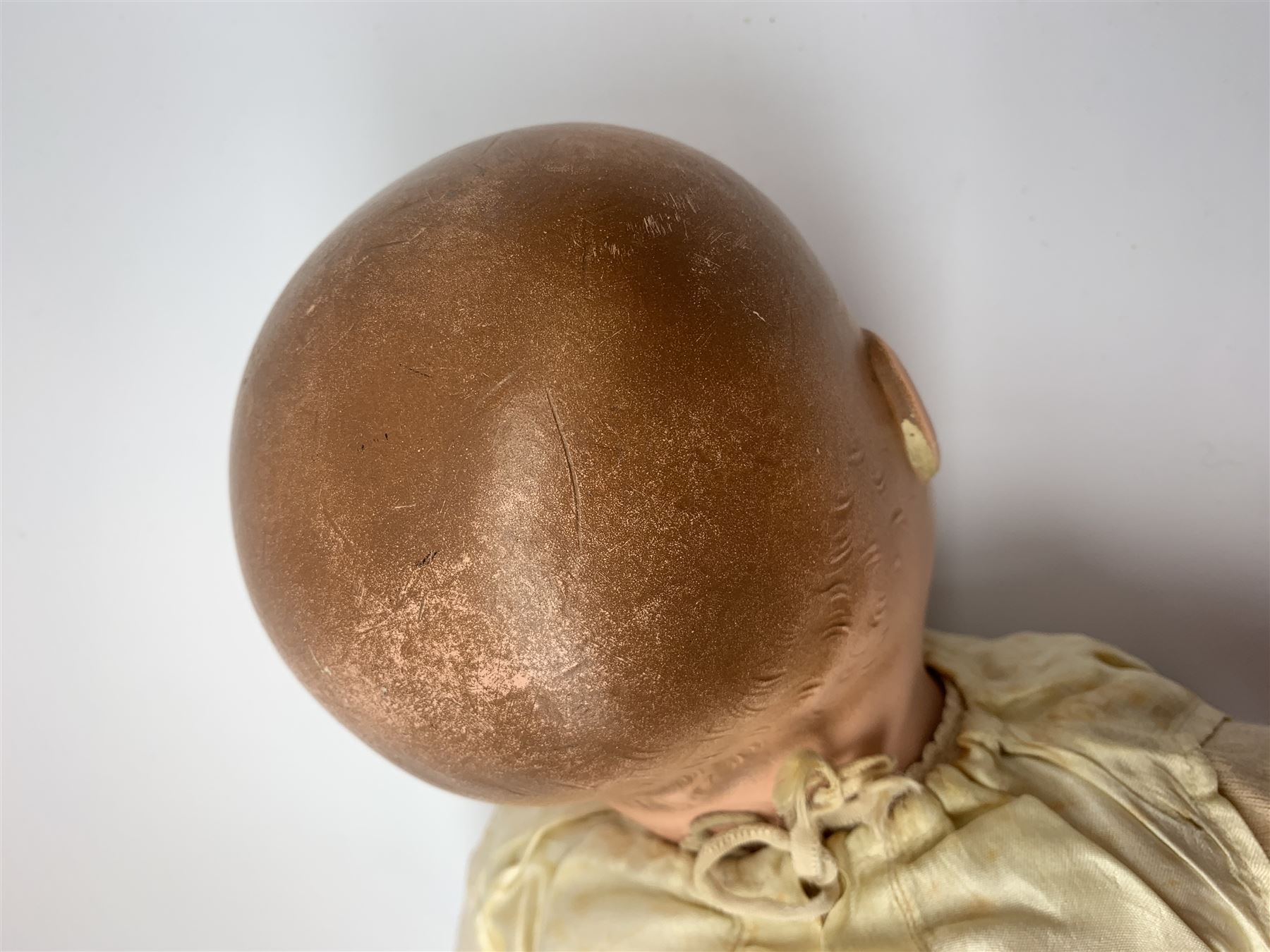 Seyfarth & Reinhardt composition head baby doll with moulded hair, sleeping flirty eyes, open mouth with one tooth and tongue and soft body with composition jointed limbs, marked 'SuR Germany 30/5' H47cm; together with a Golborne Dolls 'Golborne Beauty' composition head and body bride doll, marked 'F.P.23' in original box H63cm (2)