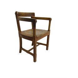 Arts and Crafts oak armchair, curved cresting rail with chamfered arm supports over panelled seat, raised on chamfered supports united by H-stretcher