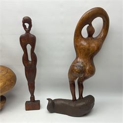 Helen Skelton (British 1933 – 2023): Three carved wooden abstract sculptures, each modelled as a a figure, tallest H52cm. Born into an RAF family in 1933 in Kent and travelled the world extensively during her childhood. After settling in Bridlington, Helen immersed herself in painting, textiles, and wood sculpture, often inspired by nature's beauty. Her talent was showcased in a one-woman show at Sewerby Hall and recognised with the sculpture prize at Ferens Art Gallery in 2000. Sadly, Helen’s daughter passed away from cancer in 2005. This loss inspired Helen to donate her sculptures to Marie Curie upon her passing in 2023.