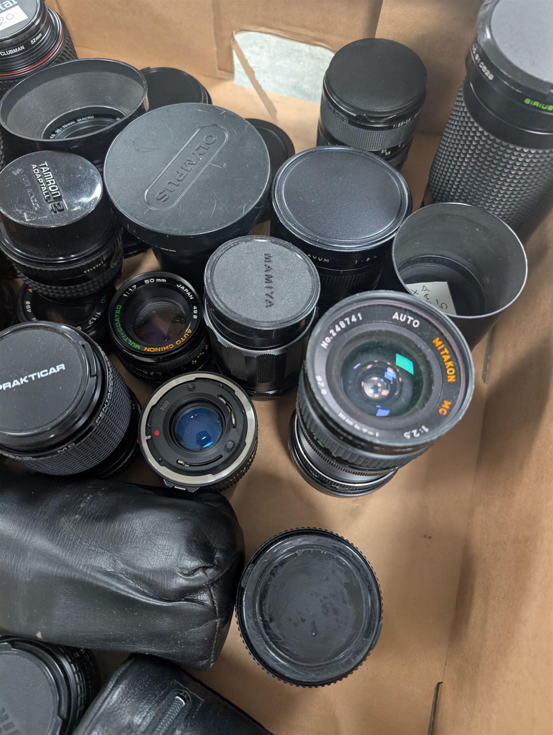 Collection of camera lenses, including and Olympus, Nikon, Sirius, Mamiya, Pentacon, Hanimex etc and Tamron adapters