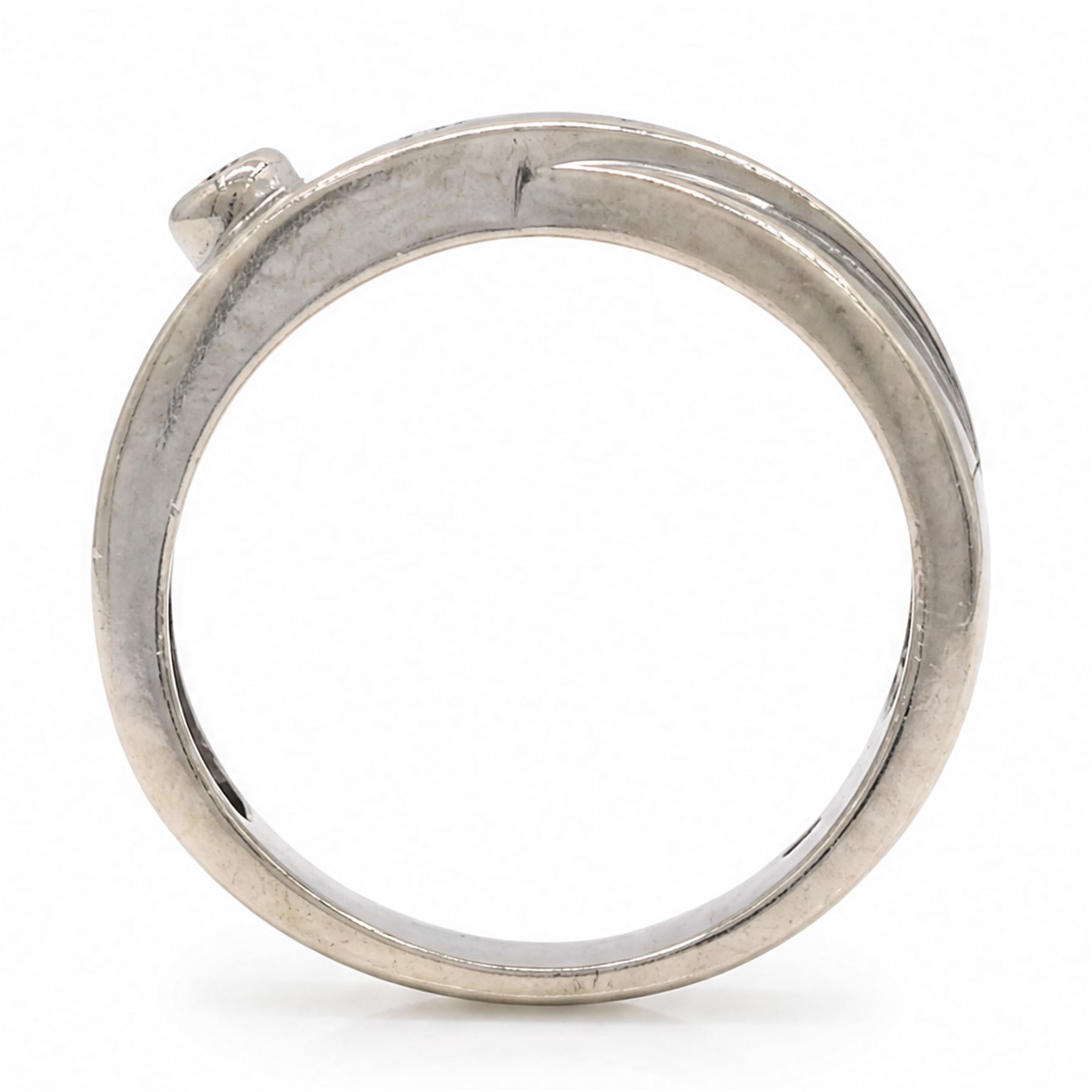 14ct white gold four stone diamond crossover ring, rubover and bezel set with four round cut diamonds, stamped 585