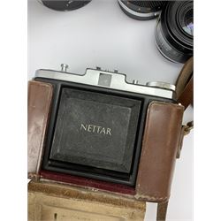 Vintage cameras lenses and accessories including Olympus 'OM10' camera body, Olympus 'OM4' camera, 'Olympus OM-System Zuiko auto-zoom 35-70mm 1:4' lens, various other lenses, tasco binoculars etc, in one box