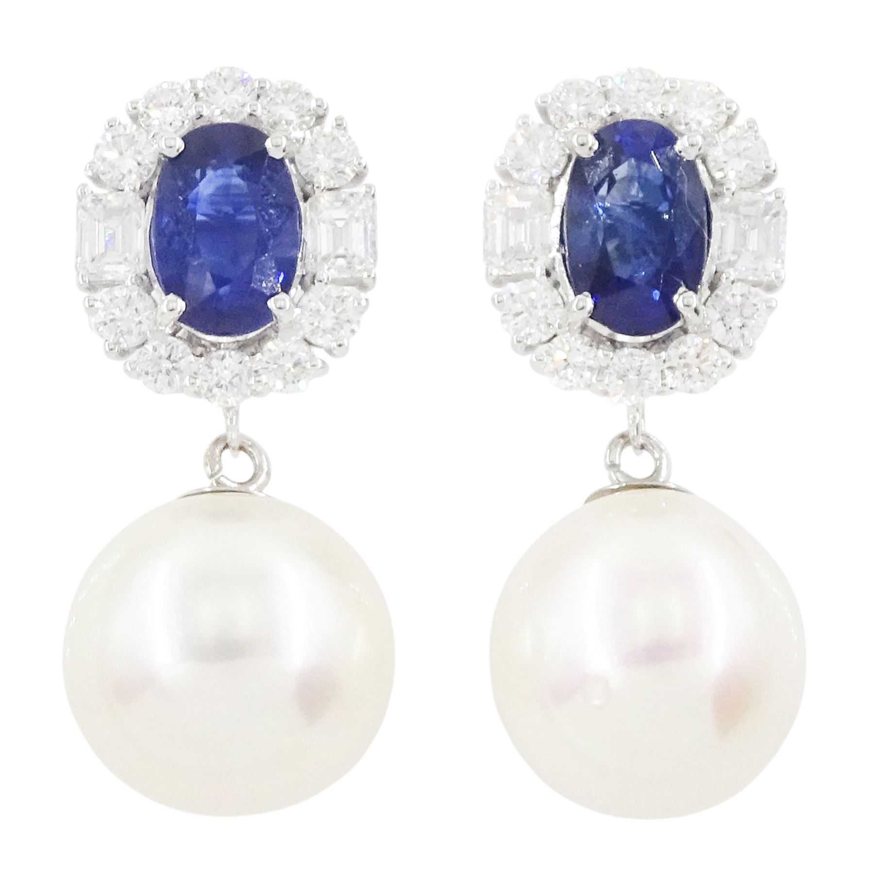 Pair of 18ct white gold sapphire, diamond and pearl pendant stud earrings, the oval cut sapphires, round brilliant cut and emerald cut diamond clusters, suspending a culture white / pink pearl, stamped 18K, total sapphire weight approx 2.15 carat, total diamond weight approx 1.00 carat