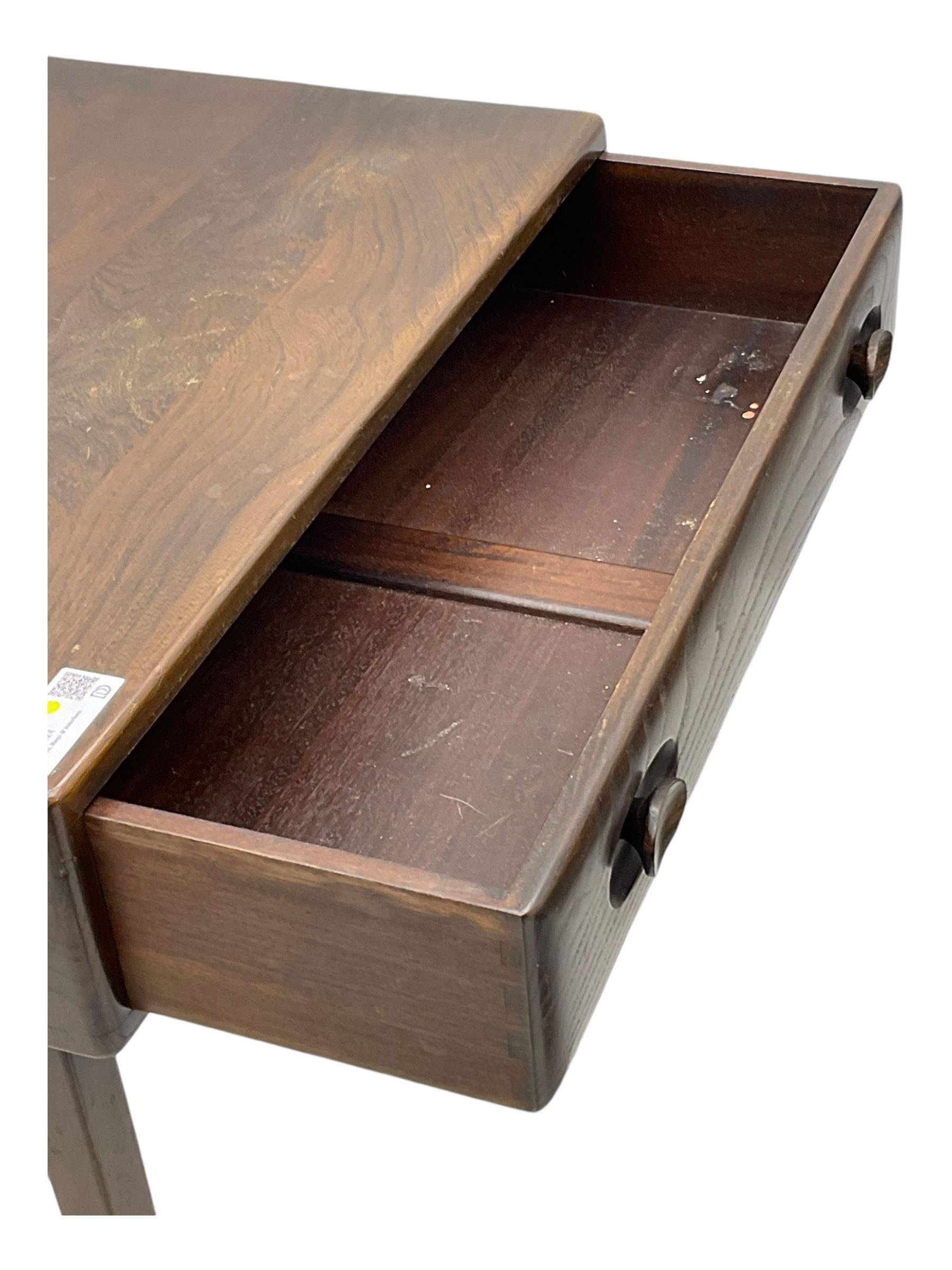 Ercol - dark elm console table, fitted with single drawer, on square tapering supports 