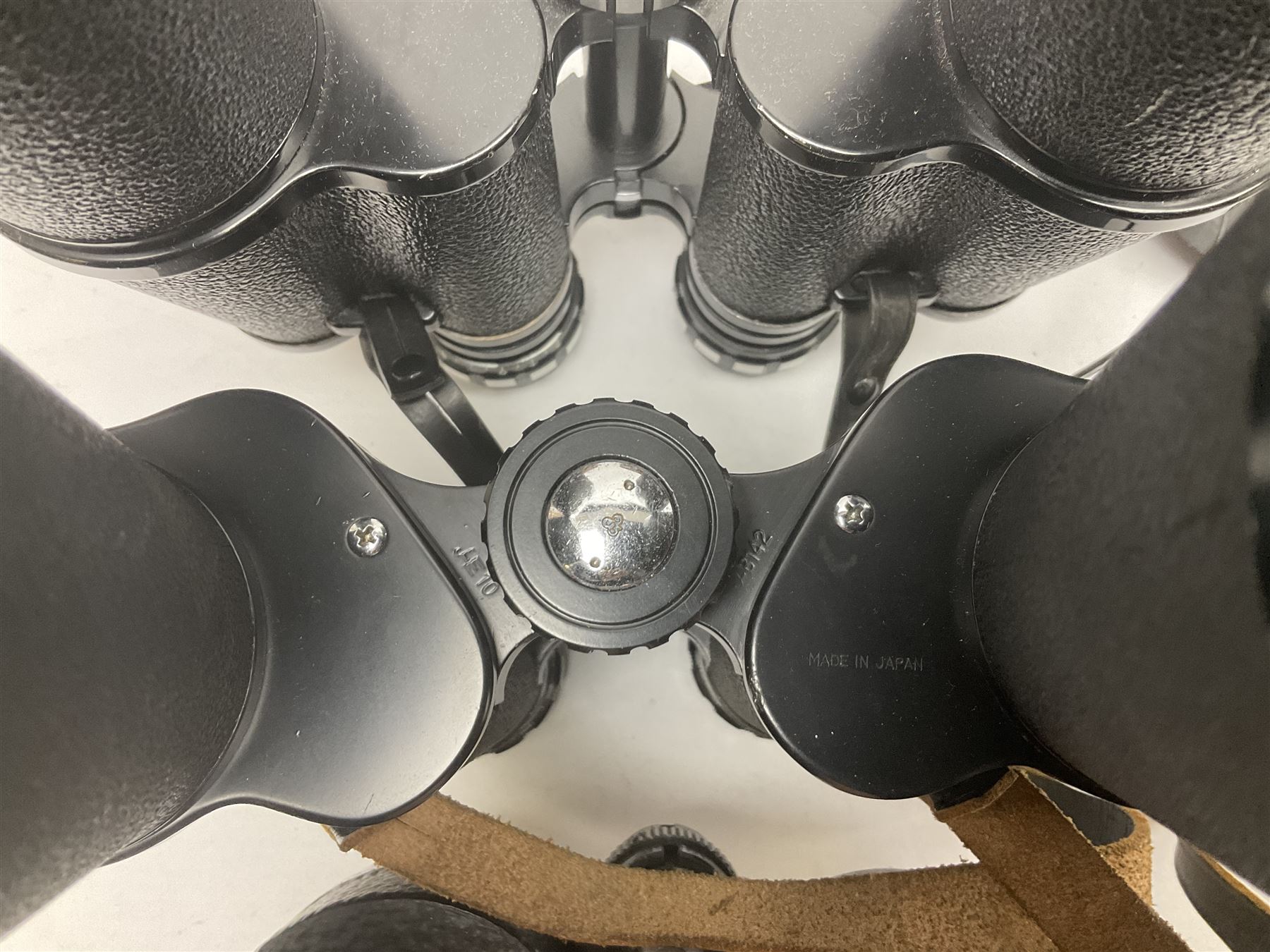 Ten cased pairs of binoculars, to include Ross London Steplux 7x50, Ross Solaross 16x60, Crescent zoom 7x- 12x50, Hilkinson 20x60,  Ross Stepnada 7x30,  Philo 10x50 etc