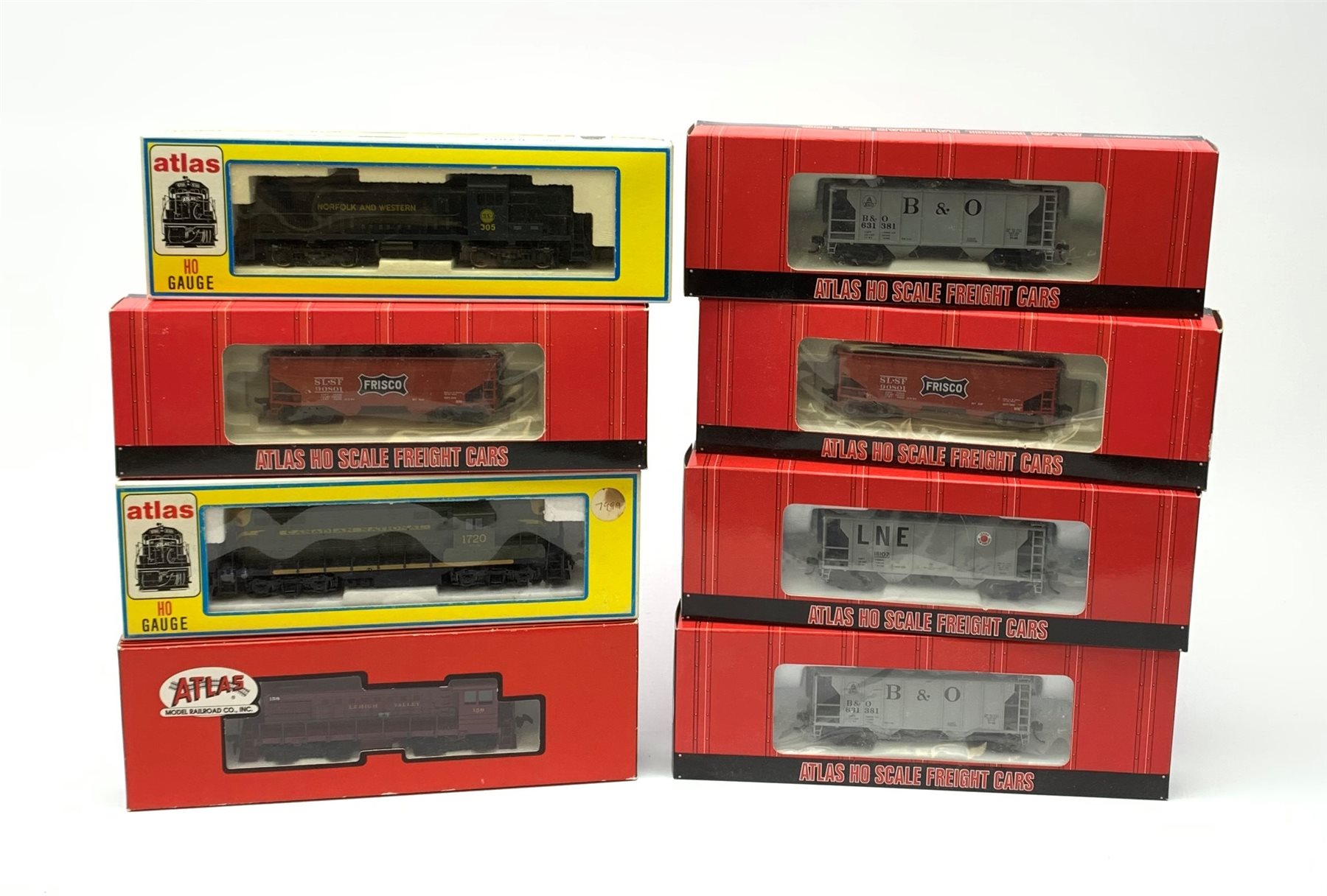 Atlas HO scale - three locomotives comprising Lehigh Valley Alco-S2 Diesel Switcher No.158, Norfolk & Western 7076 RS-3 Diesel No.305 and Canadian National 8228 GP-7 Diesel No.1720; three Baltimore & Ohio PS-2 Covered Hopper wagons; and two Frisco 2-Bay Offset Side Hopper wagons, all boxed and virtually mint (8)