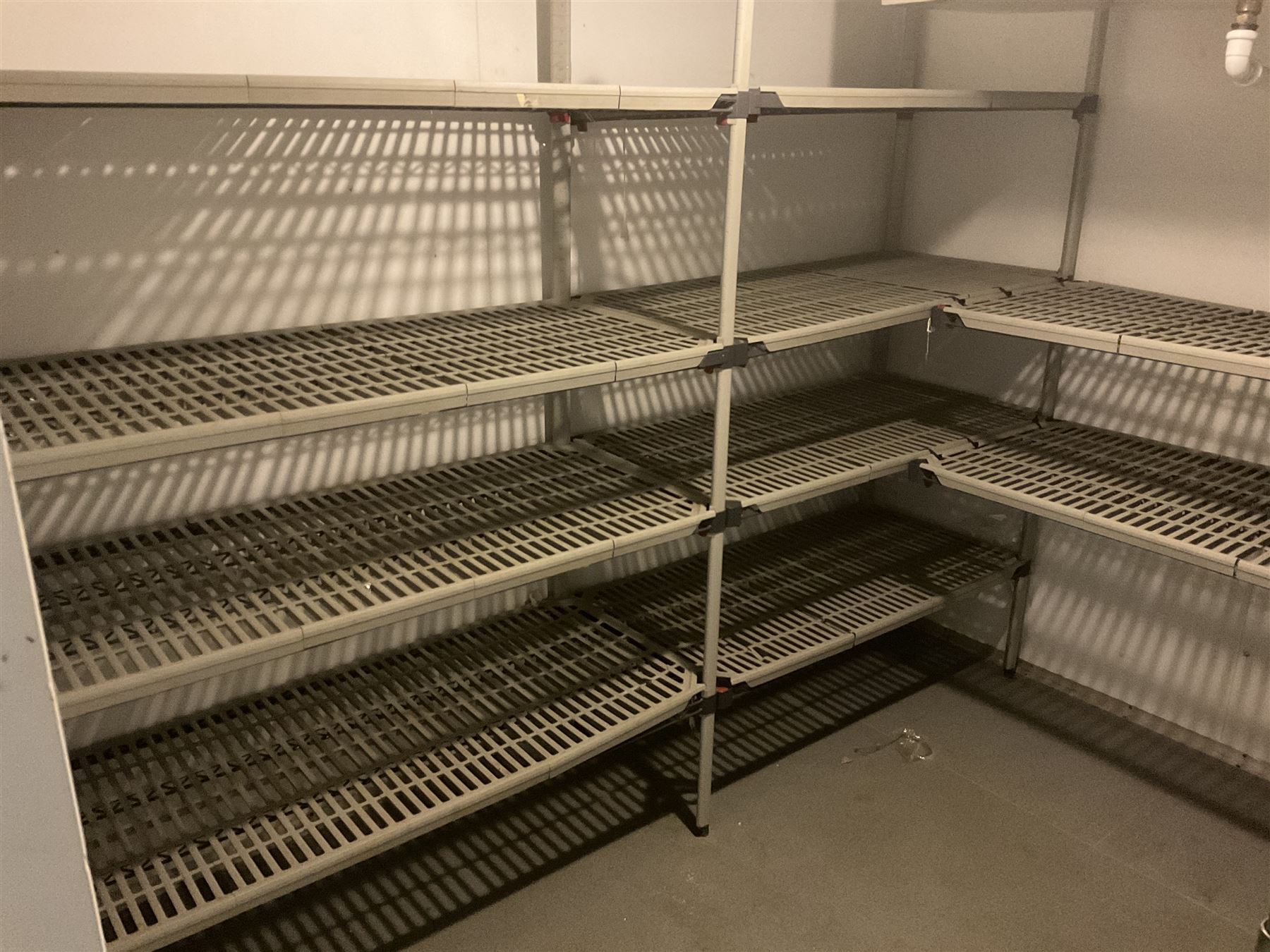 Metal four tier shelving racking x 3, plastic racking and shelving- LOT SUBJECT TO VAT ON THE HAMMER PRICE - To be collected by appointment from The Ambassador Hotel, 36-38 Esplanade, Scarborough YO11 2AY. ALL GOODS MUST BE REMOVED BY WEDNESDAY 15TH JUNE.