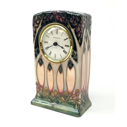 A Moorcroft mantle clock, decorated in the Cluny pattern designed by Sally Tuffin, with impressed and painted marks beneath, H15.5cm.