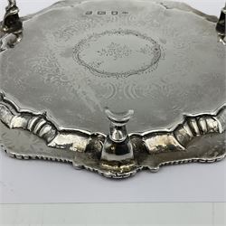 George III silver waiter, of hexagonal form, with shaped oblique gadrooned rim, embossed with anthemion to each corner, engraved with C scroll, floral and foliate decoration to centre, upon three trefid feet, hallmarked Richard Rugg I, London 1761, D18.8cm