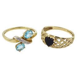 Gold topaz and diamond chip crossover ring and a gold black onyx heart shaped ring, both hallmarked 9ct