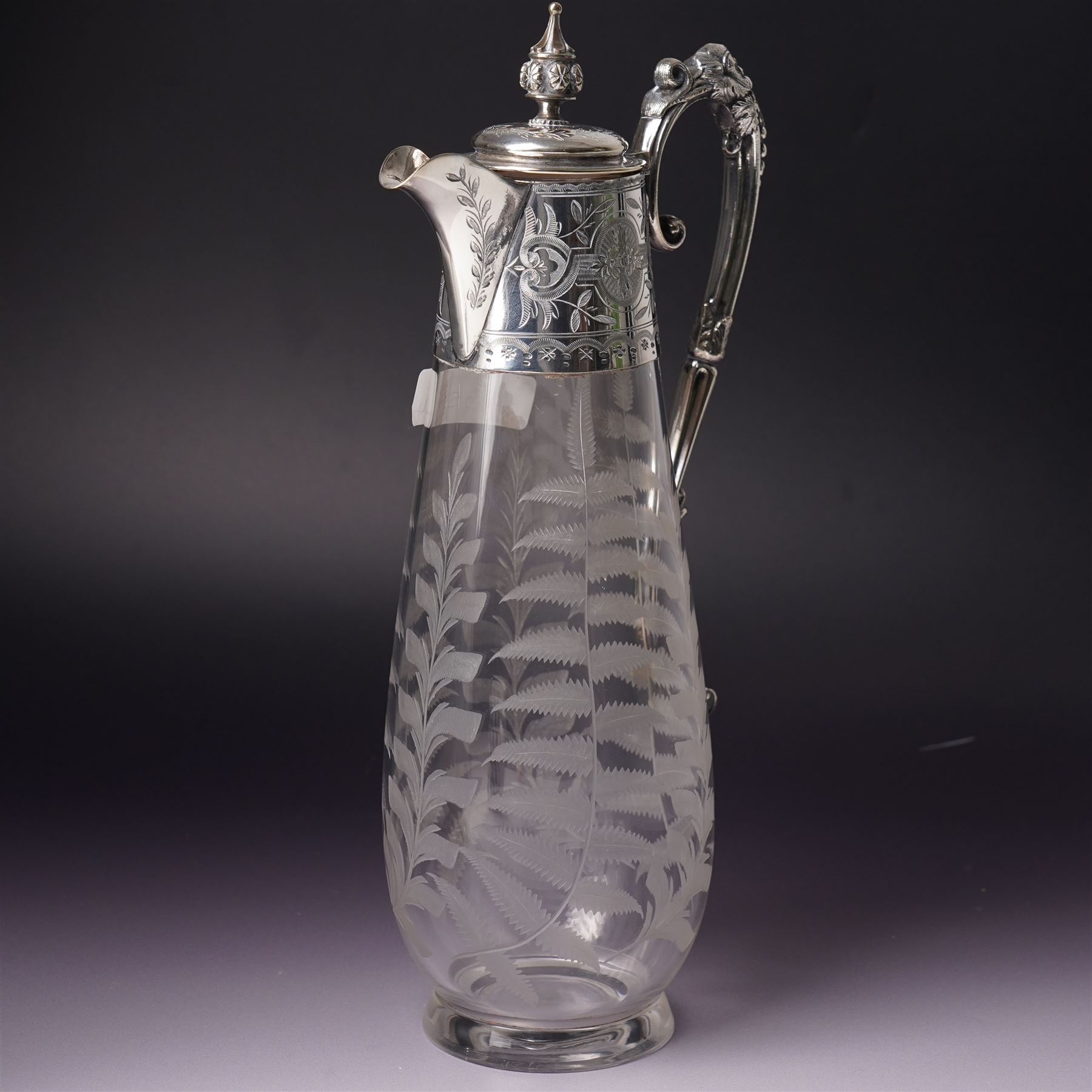 Victorian opaque glass ewer with clear cut decoration and clear glass handle H28cm and an etched glass claret jug with silver plated cover and handle H31cm