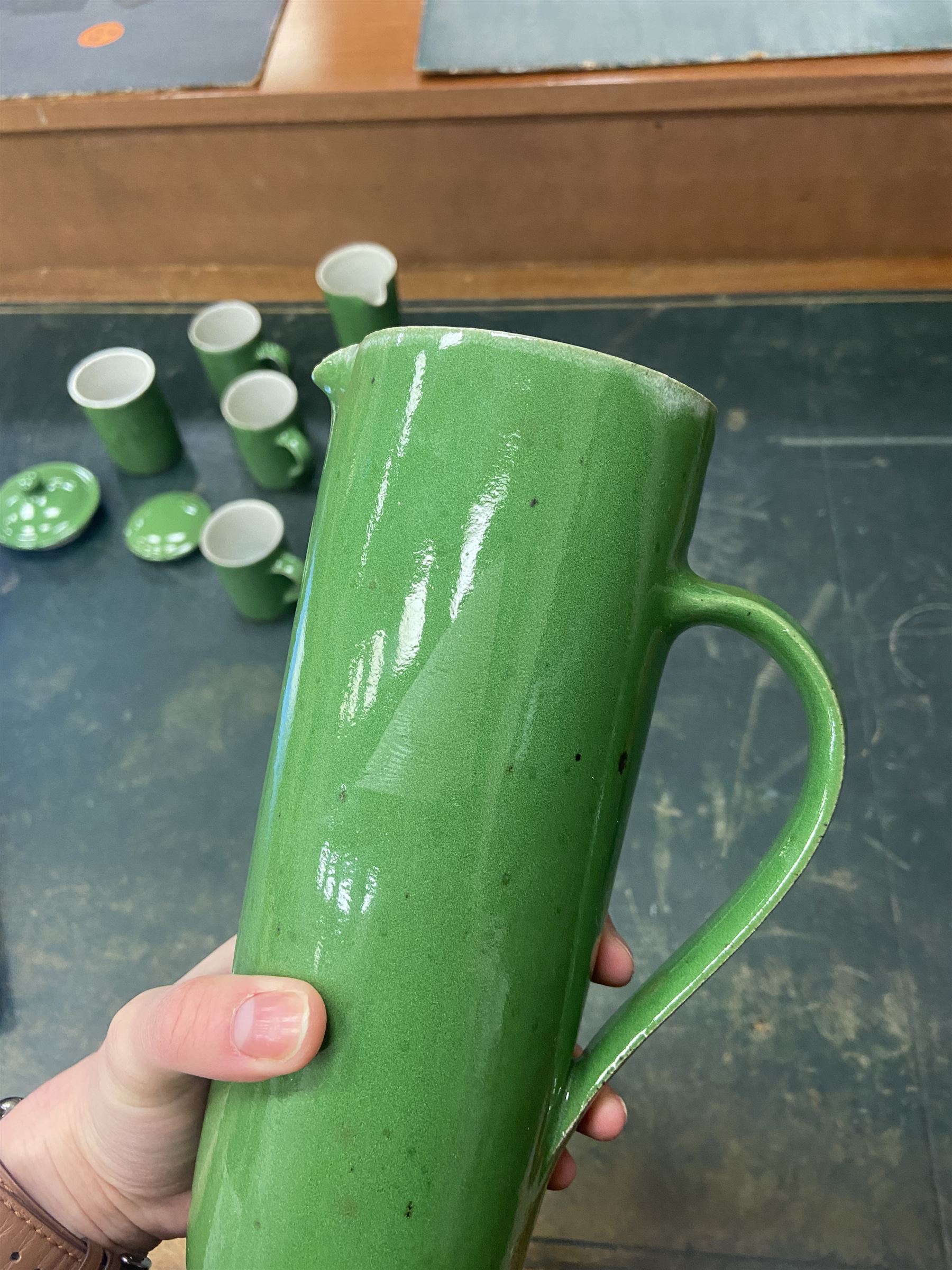 Rupert Spira (born 1960) stoneware coffee service decorated with vivid green glaze, comprising coffee pot, three cups, lidded sucrier and milk jug, all having impressed RS marks beneath, tallest H25cm