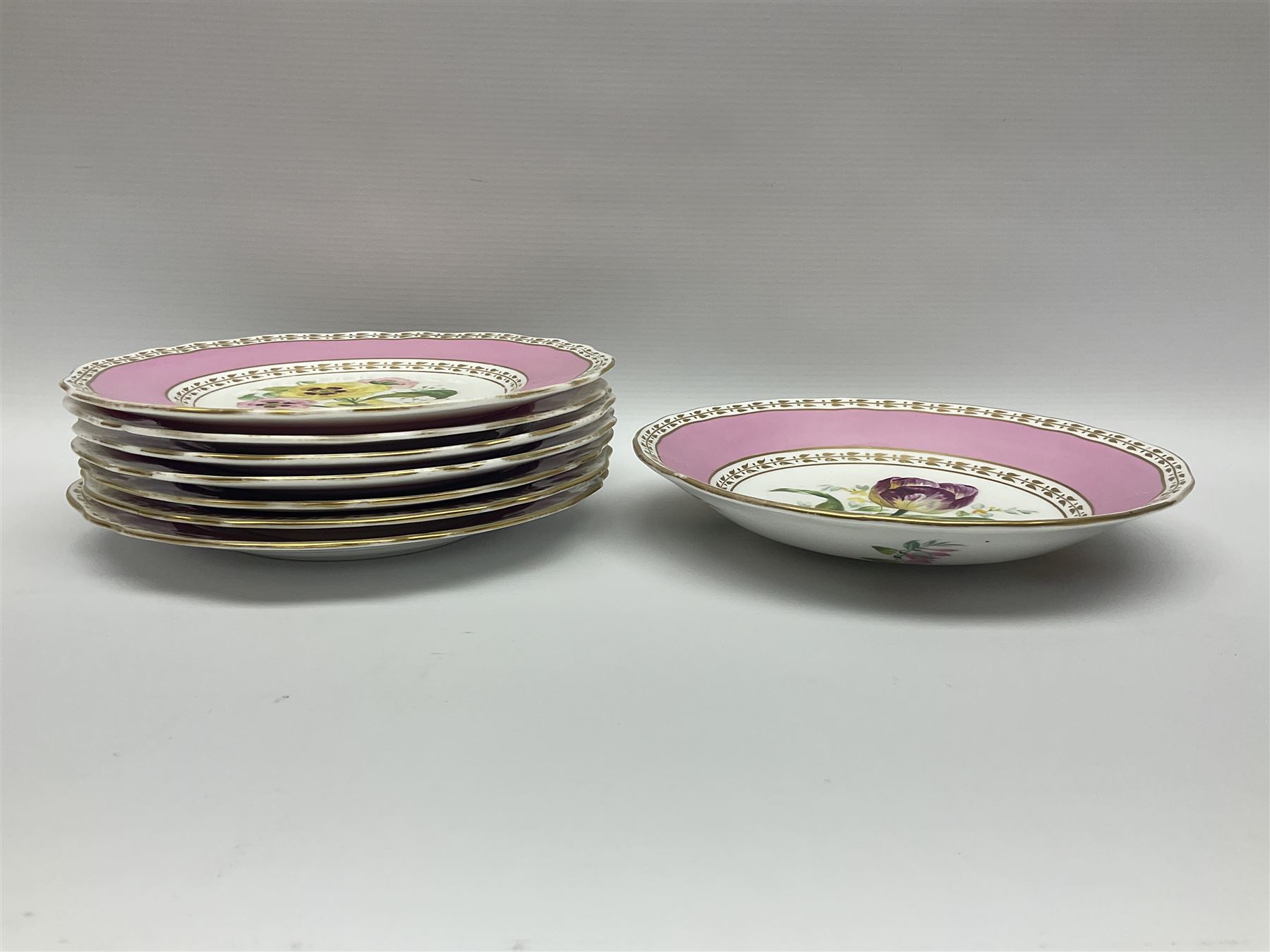 Victorian Copeland, Botanical dessert service, decorated with floral sprigs to the centre with a pink and gilt border, comprising five comports and seven plates, largest comport H20cm, plate D22cm