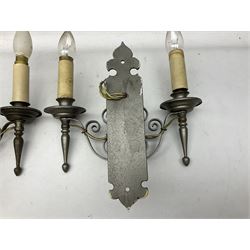 Pair of metal twin wall lights with scrolled branches and glass chimneys