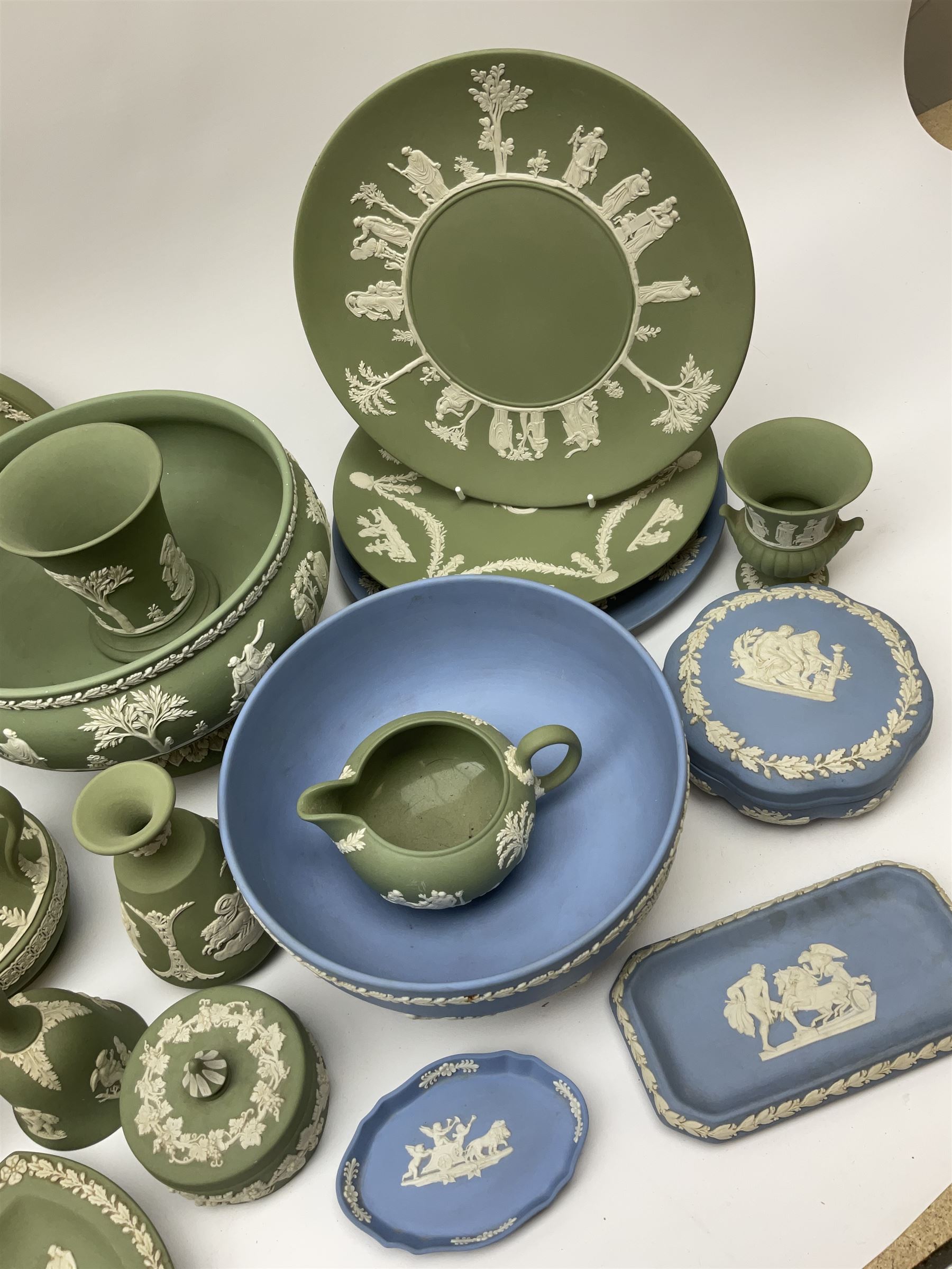 Collection of Wedgewood light blue and sage green Jasperware, to include blue bowl, D20cm, green footed bowl, D20cm, two large vases, trinket boxes, jugs, plates, etc., (29), together with a Wedgewood Black basalt coffee set, comprising coffee pot, milk jug, lidded sugar bowl and six coffee cans and saucers. 