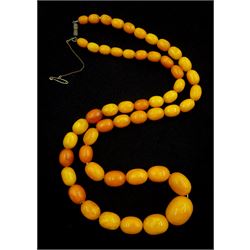 Amber bead necklace, single strand of graduating oval beads, the largest bead measuring approx 25mm x 20mm, the smallest measuring approx 10mm x 7mm