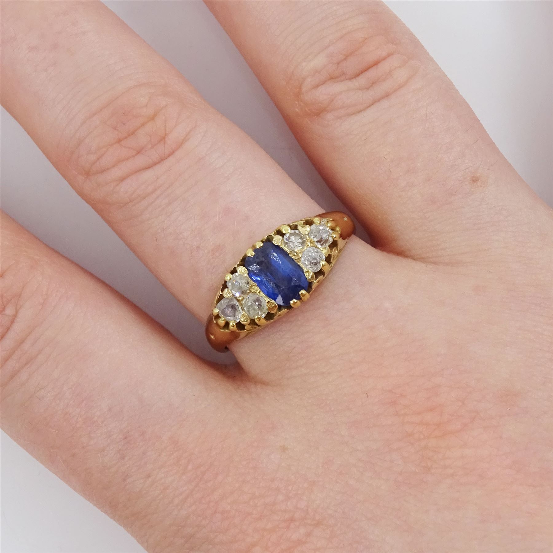 Gold cushion cut sapphire and six stone, old cut diamond ring, stamped 18ct, sapphire approx 0.70 carat, total diamond weight approx 0.35 carat