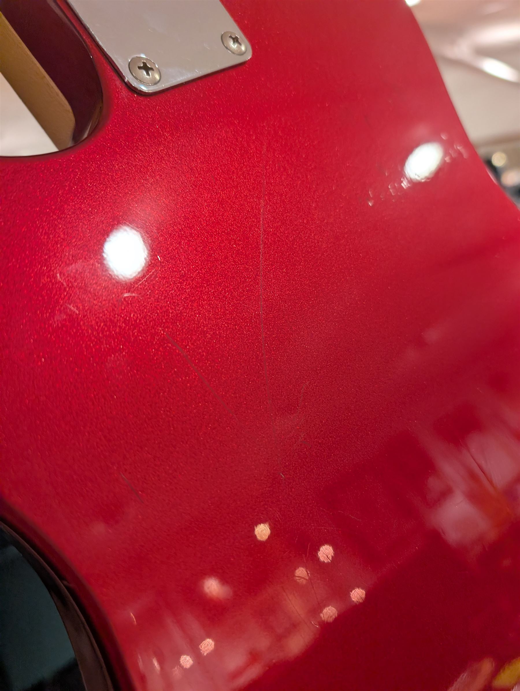 Fender Telecaster electric guitar, serial no. T021384 made in Japan c.1994, with Candy Apple Red body, white scratch plate and maple neck, guitar L98cm