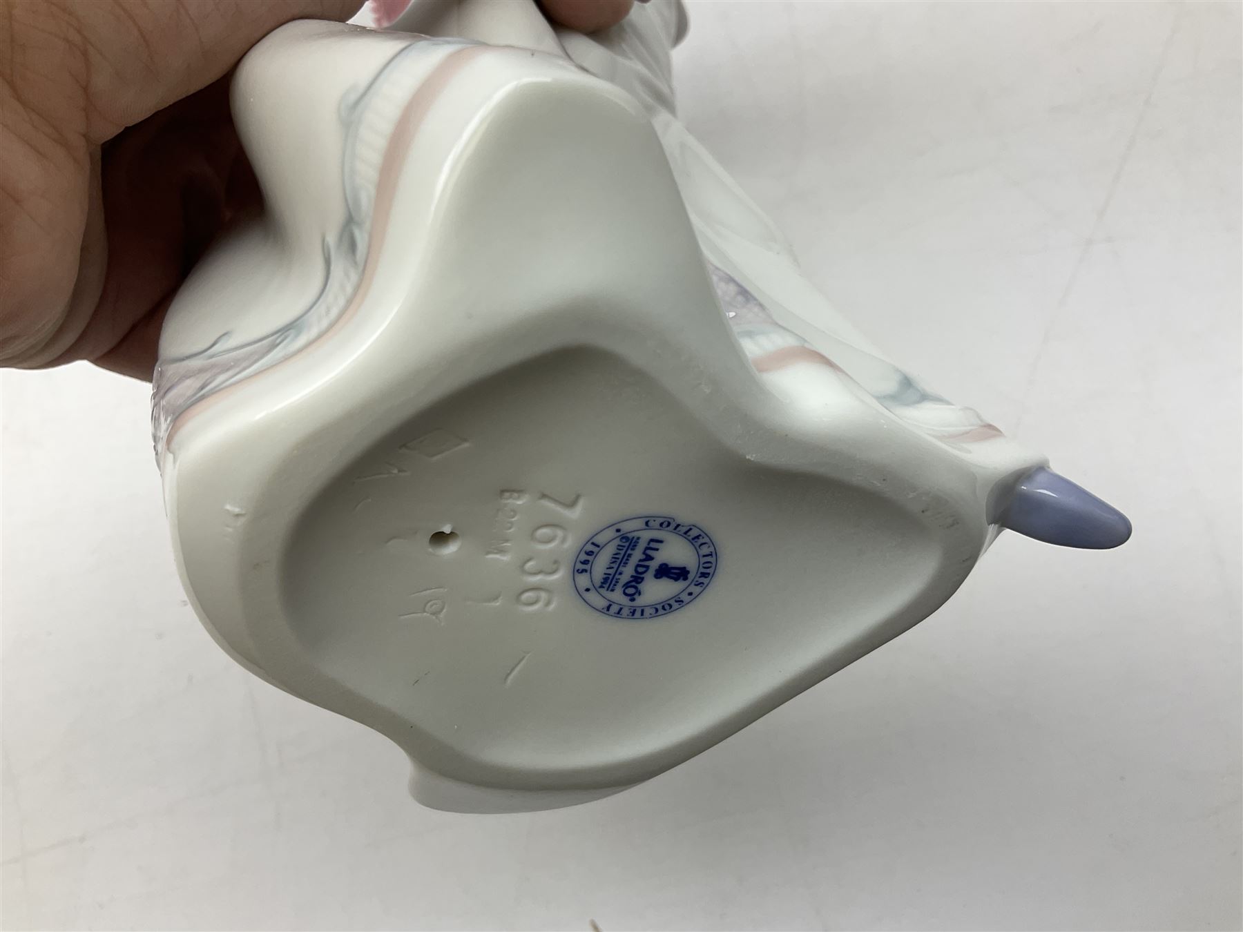 Four Lladro figures, comprising Afternoon Promenade no 7636, Nostalgia no 5071, both with original boxes, Girl with Lilies no 4972 and Madonna no 4534, largest example H27cm