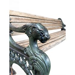 Neoclassical design cast iron and oak slatted garden bench, the twin end supports in the form of a Sphinx with acanthus carved knees and large paw feet, the pierced lattice bracket with Yorkshire rose motifs