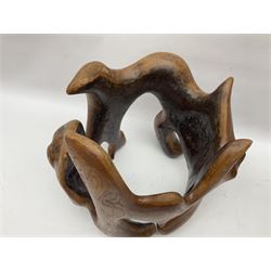 Helen Skelton (British 1933 – 2023): Two carved wooden abstract sculptures, one modelled as a entwined knot, largest H48cm. Born into an RAF family in 1933 in Kent and travelled the world extensively during her childhood. After settling in Bridlington, Helen immersed herself in painting, textiles, and wood sculpture, often inspired by nature's beauty. Her talent was showcased in a one-woman show at Sewerby Hall and recognised with the sculpture prize at Ferens Art Gallery in 2000. Sadly, Helen’s daughter passed away from cancer in 2005. This loss inspired Helen to donate her sculptures to Marie Curie upon her passing in 2023.