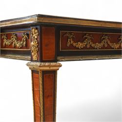 Fine 19th-century Louis XVI-style mahogany and gilt bronze-mounted writing table, rectangular top with a gilt tooled tan leather writing surface within a moulded gilt bronze edge above a frieze fitted with three drawers, mounted with floral and foliate gilt bronze swags  and borders, raised on square tapering legs with acanthus mounts and toupie feet
