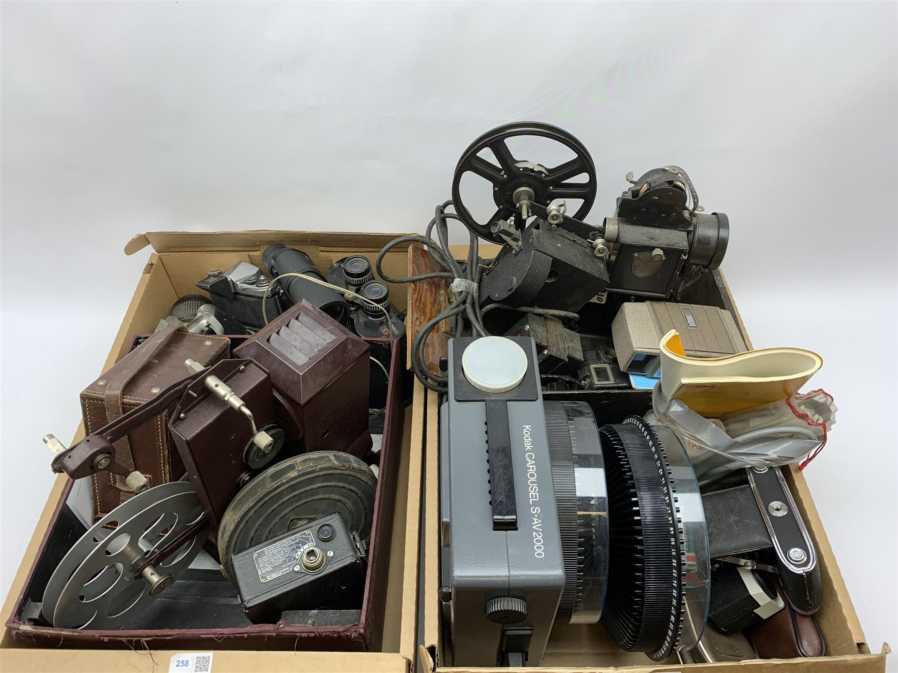 Various vintage cameras, projectors and other similar items including 'Kodatoy' universal model projector, 'AGFA Isolette II' camera, 'G.B. - Bell & Howell' 624 8mm, Chinon 7x50 field 7.1 vintage binoculars etc, in two boxes, all untested 