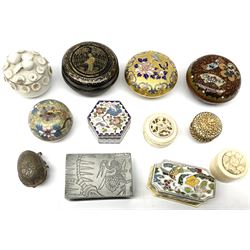 Group of snuff and other boxes of various form, to include a number of Oriental examples, including black papier-mâché box decorated in gilt with figure before a fence, Cloisonné example modelled in the form of an apple with pendant suspended from the stalk stamped 14, three other Cloisonné examples two Chinese Canton ivory examples, base metal matchbox holder decorated with birds, etc. 