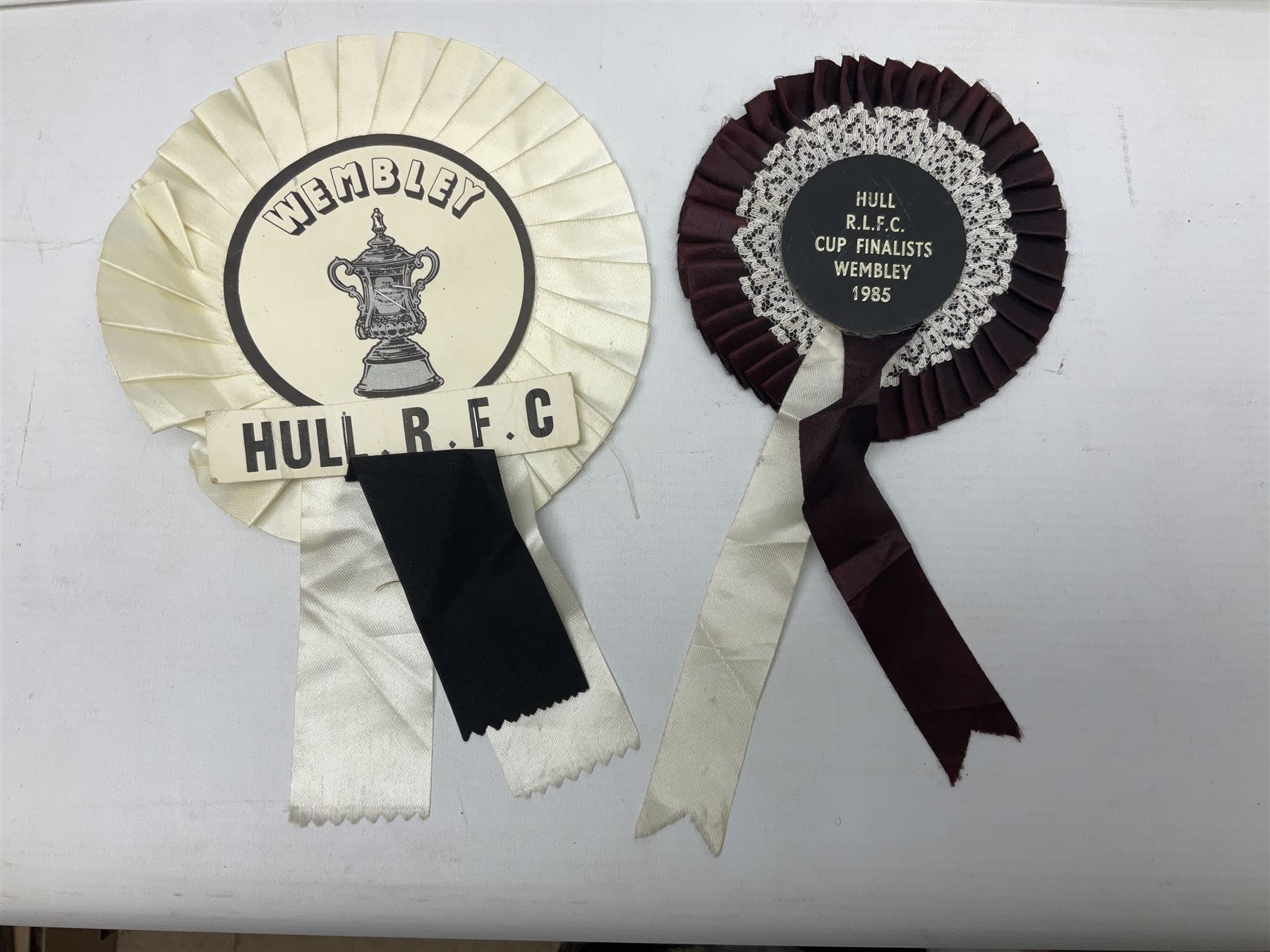 Hull F.C. memorabilia; Clive Sullivan 1986 memorial game programme, Open Evening 1994 programme with multiple player signatures, 'Old Faithful' 45rpm record, Wembley rosettes, 2000 team poster with facsimile signatures, framed print 'Farewell to the Boulevard 1895-2002', fully signed team photograph, various booklets, CD, DVD etc; and a folder containing the Merlin Rugby League card collection
