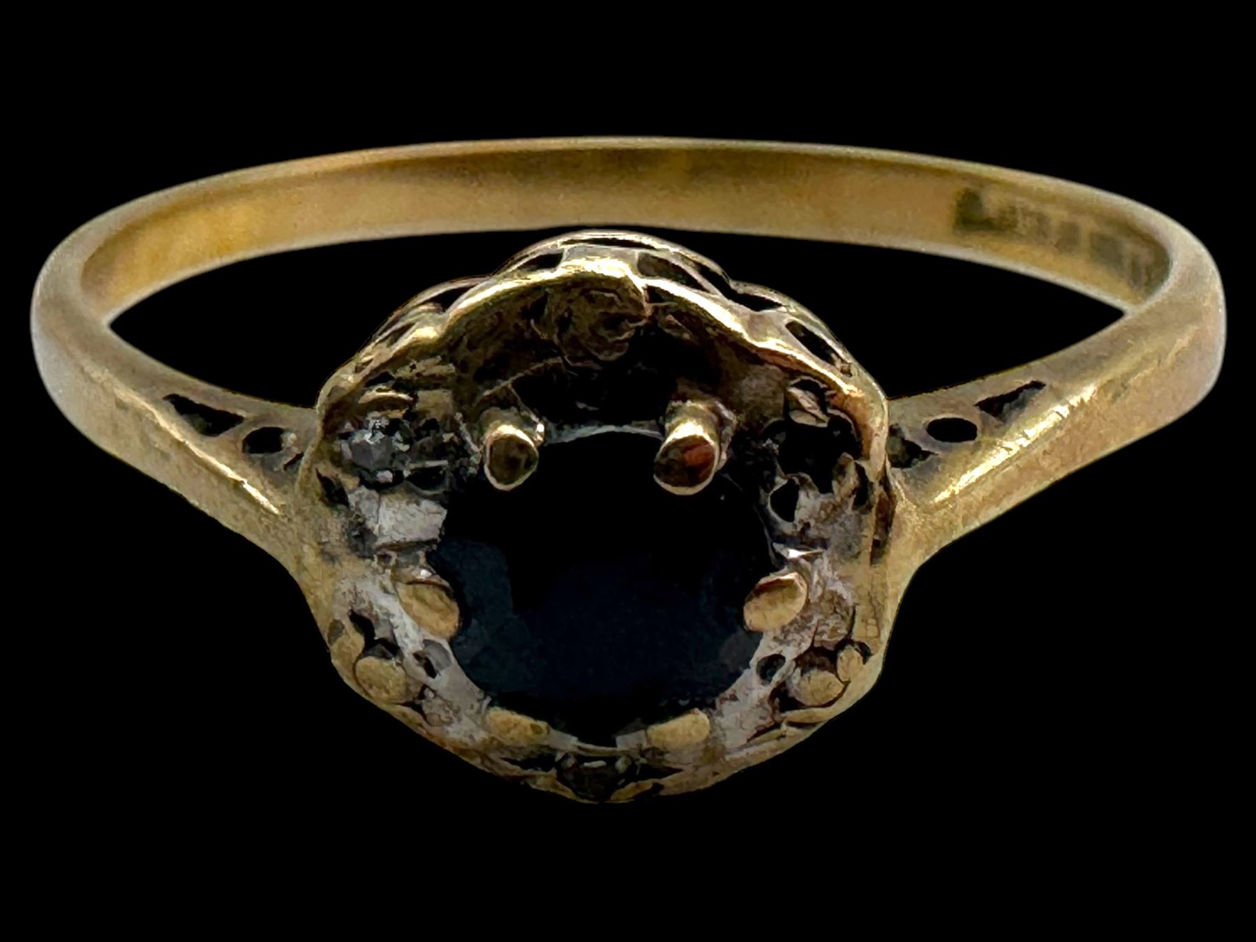 Four 9ct gold stone set rings, including garnet and pearl examples, all stamped or hallmarked