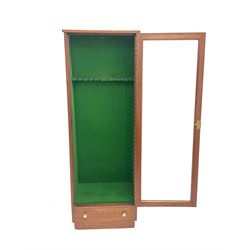 Mahogany gun cabinet for nine guns, with glazed door above a drawer