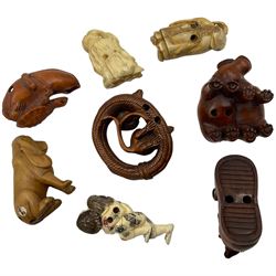 Eight wooden and composite carved netsukes, to include dog, hippos, rats etc 