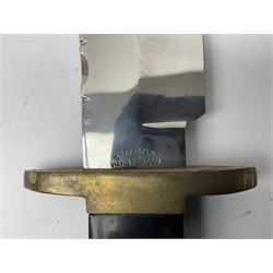 Large Bowie knife the 21cm steel blade marked J.E. Middleton & Sons Rockingham Street Sheffield with brass cross-piece and polished horn grip scales; in leather sheath L36cm overall