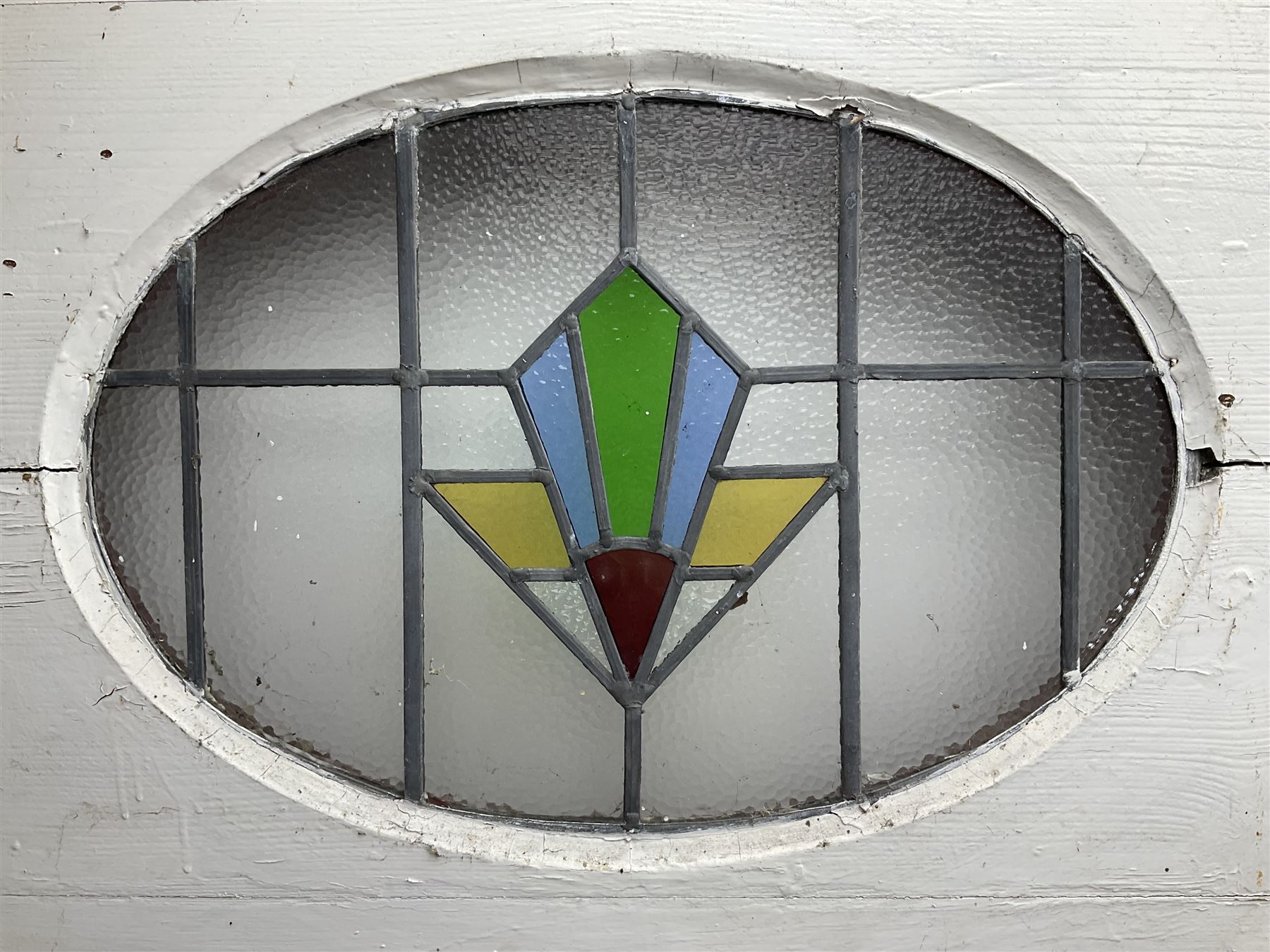 1930s external door with stained leaded glass panel (86cm x 203cm), six small stained glass windows in wooden frames (W52cm); and various loose stained leaded glass panels