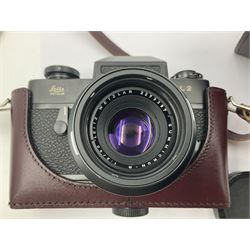 Leitz Leicaflex SL2 camera body, serial no.1387046, with 'Summicron-R 1:2/50 Leitz Wetzlar' lens, serial no. 2273397, within a leather Leitz lens hood 