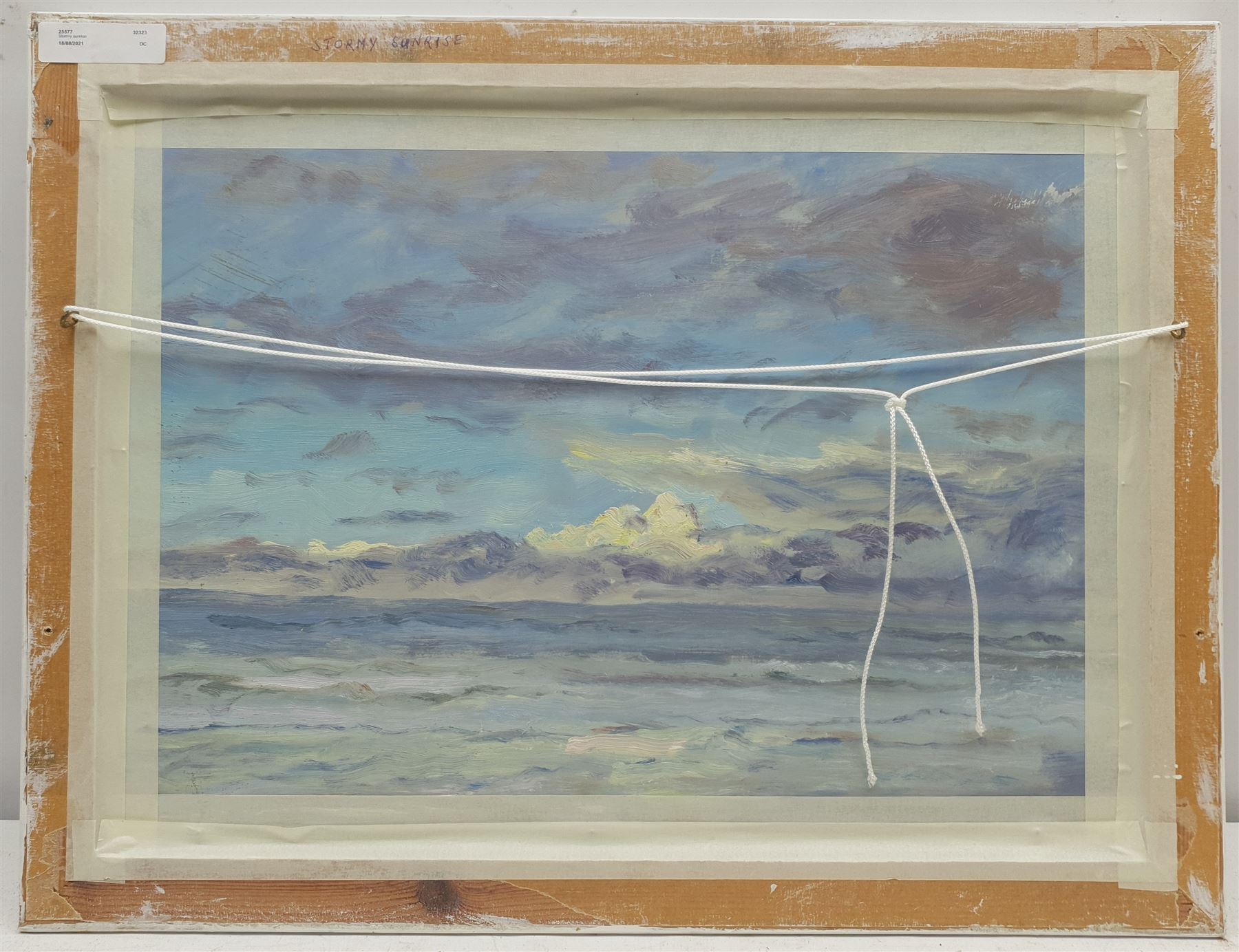 Neil Tyler (British 1945-): 'Stormy Sunrise' off the East Coast, oil on board signed, with a similar painting verso 31cm x 43cm