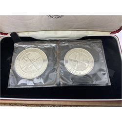 Coins including two King George VI 1951 Festival of Britain crowns each in green case, various other commemorative crowns, two Iceland '874-1974' two coin sets both in original red cases etc