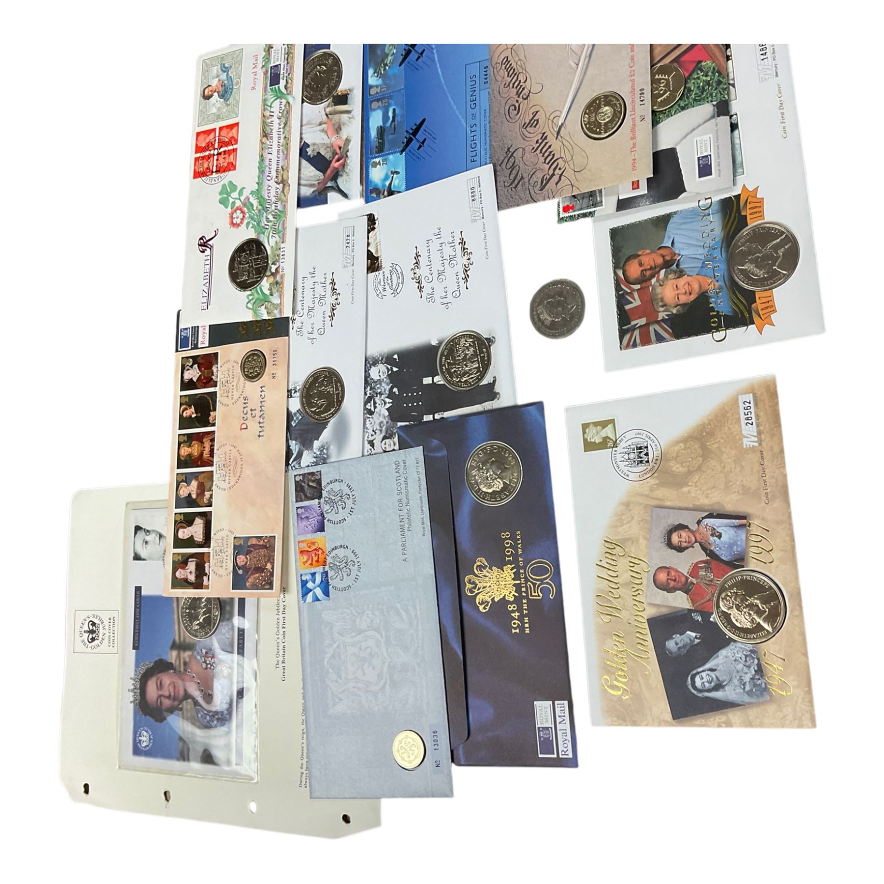 Mostly commemorative coinage, including various five pound coins, together with two stamp folders 