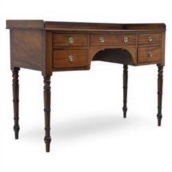 Late Georgian mahogany sideboard, circa 1820, the rectangular top with gallery, above an a...