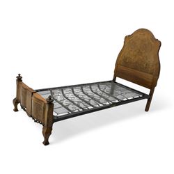 Mid-20th century walnut single bedstead, high shaped headboard, footboard with turned finials and scrollwork carvings, complete with 'Vono' iron frame, raised on cabriole supports