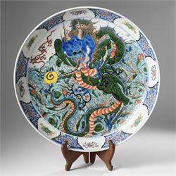 Chinese charger, decorated in blue, green and red enamels with a four clawed dragon chasin...