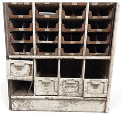 F Pollard & Co - late 19th century rustic haberdashery shop cabinet, fitted with an assortment of forty sliding trays, with drawers fitted to base, in antique white-painted finish