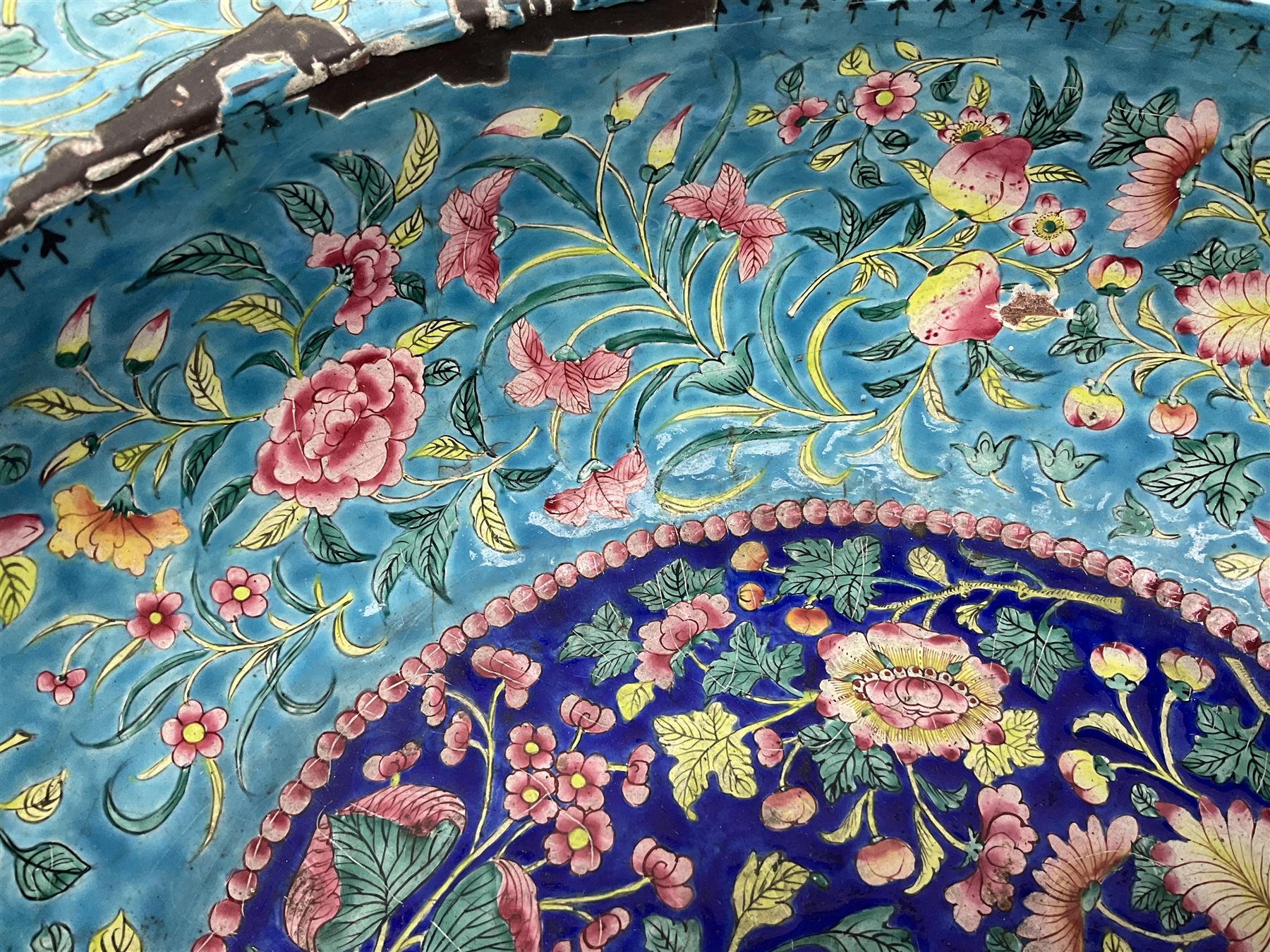 18th/19th century Chinese Canton enamel basin, the circular basin with flat everted rim, decorated with scrolling foliate and fruit decoration on a blue ground, D43cm