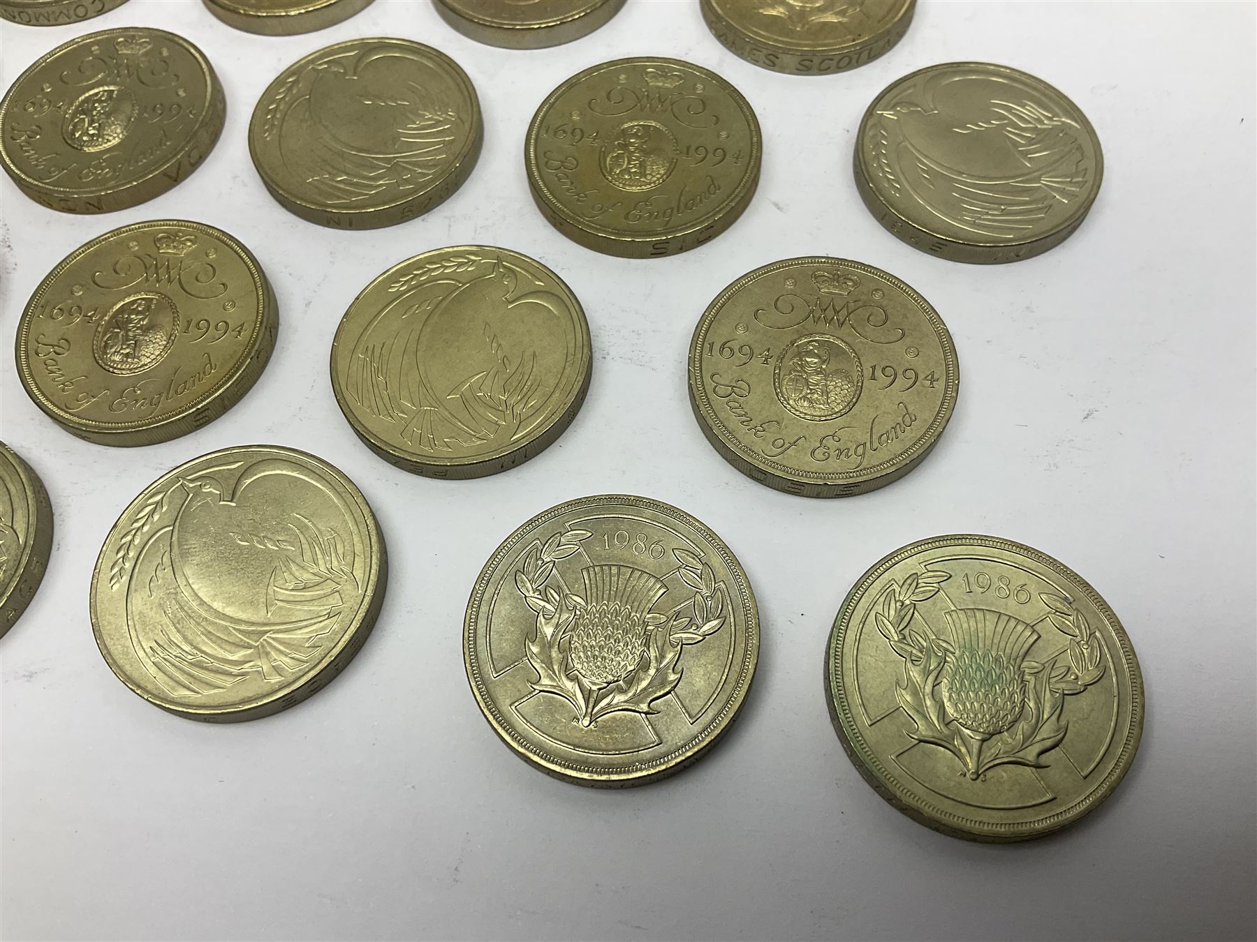 Twenty-eight Queen Elizabeth II old style two pound coins, including 1994 'Bank of England' etc