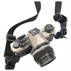 Olympus OM-4 T camera body serial no. 1126911, with two Olympus OM-System Zuiko MC Auto-S lenses, one 1:1.54 f=50mm, the other 1:1.8 f=50mm, an Auto-W 35mm 1:2 lens, Olympus OM winder 2, flash and other accessories, in a Tamrac carry case 