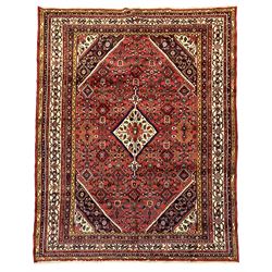 North West Persian Hamadan carpet, the extended lozenge field decorated with Herati motifs, central lozenge medallion, multiple border bands decorated with geometric designs 