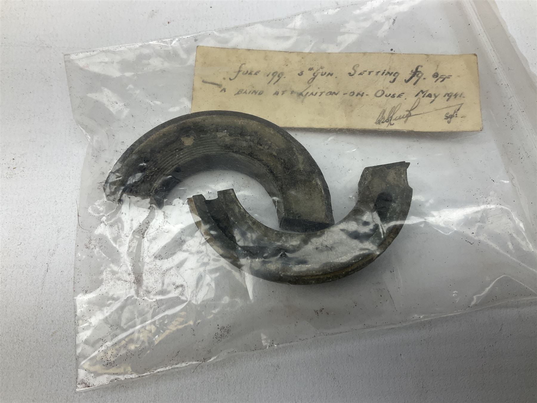 Small collection of WW2 shrapnel and German and British shell parts, most with manuscript details of where and when found including London, Leeds, Bristol, Linton-on-Ouse etc