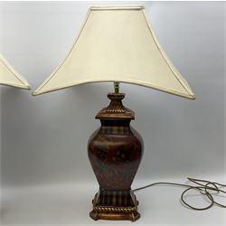 Pair Oriental table lamps decorated with birds in a tree with fruit, on a red ground with a gilded base together with cream lampshades H57cm, without lampshade. 